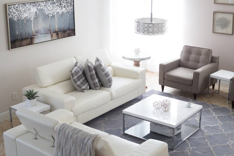 Finished living space with sofa and lighting