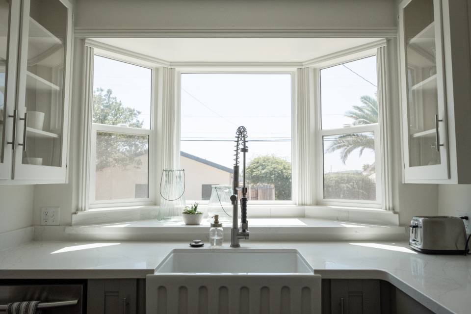 White kitchen with bay window